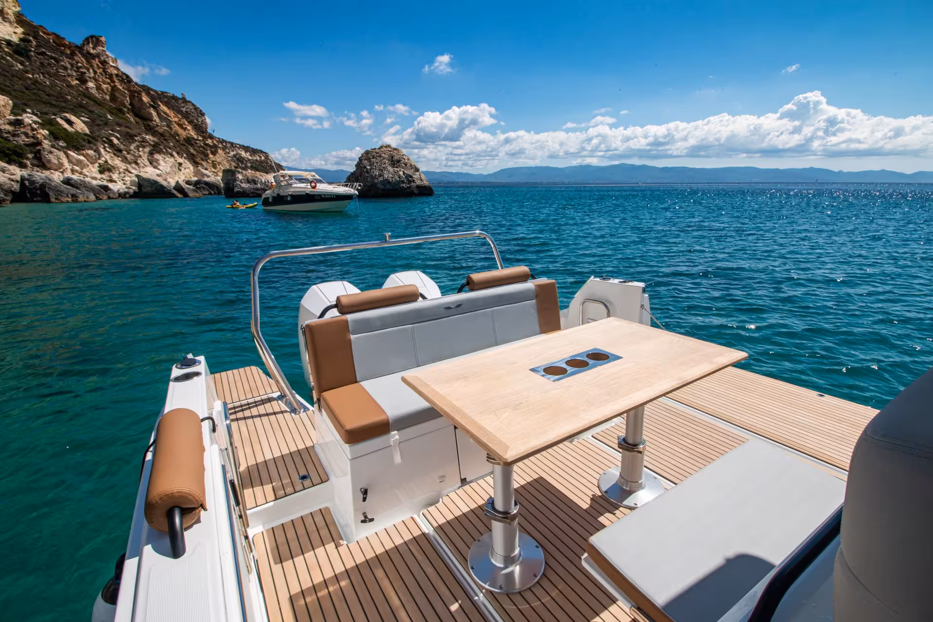 Relax on a spacious boat deck while exploring Cagliari's scenic coastline on a 3-hour tour in Sardinia.