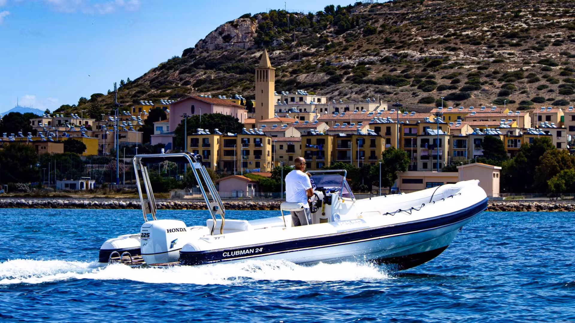 Explore Cagliari's stunning coastline on a thrilling dinghy tour with panoramic views of historic architecture.