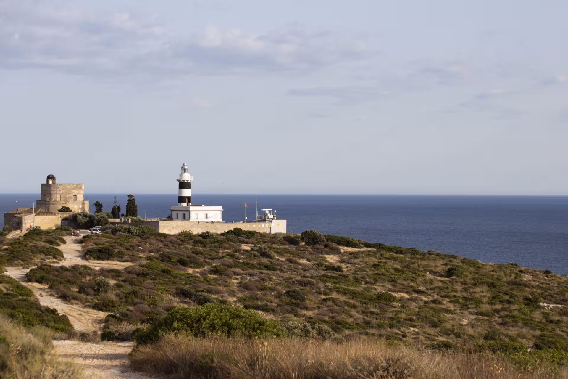 Lighthouse and historic building on Sant'Elia hill, with panoramic views of the Mediterranean Sea in Cagliari.