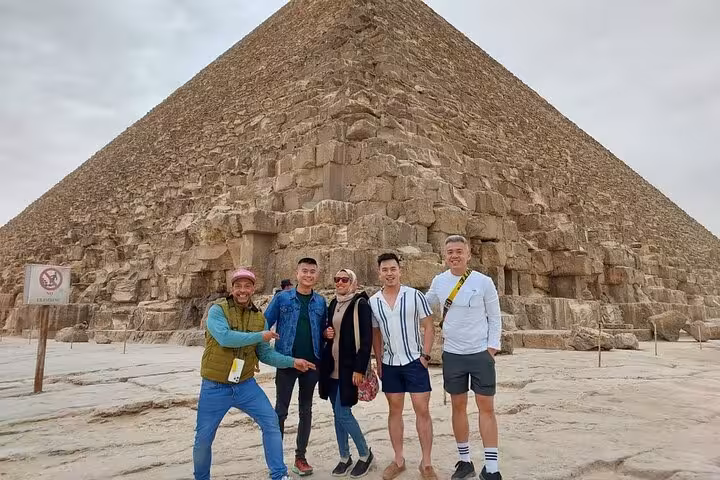 Small group at the Great Pyramid of Giza on a 3-day Cairo tour with museums and Coptic churches included