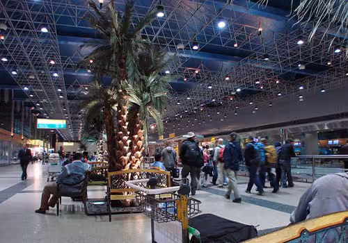 Cairo Airport arrivals hall with travelers, ideal for private arrival transfer to Cairo hotel with meet and greet