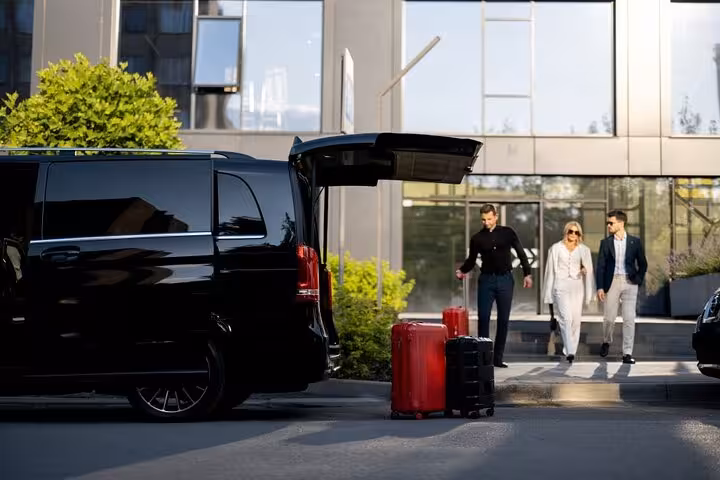 Private black van with luggage for Cairo Airport pickup and drop-off transfer, door-to-door service in Cairo