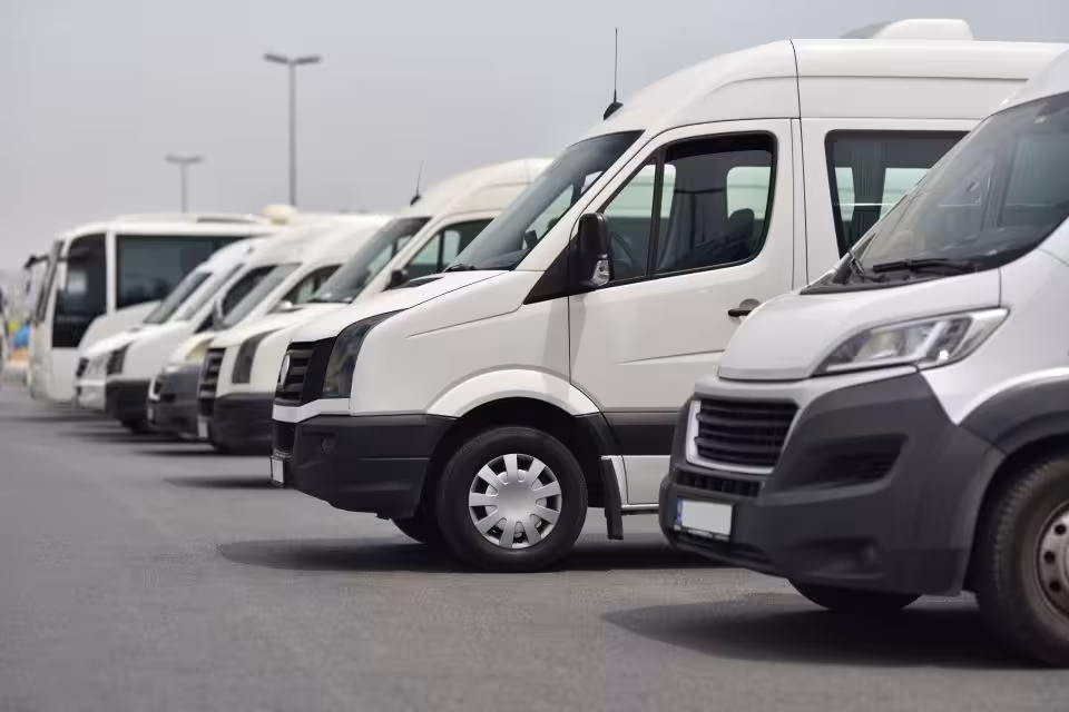 Fleet of modern vans lined up for Cairo Airport private transfers, reliable arrival and departure service