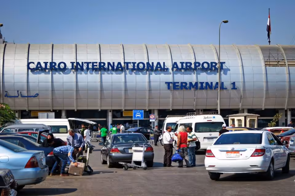 Cairo International Airport Terminal 1 exterior with traffic, ideal for private hotel to airport transfer