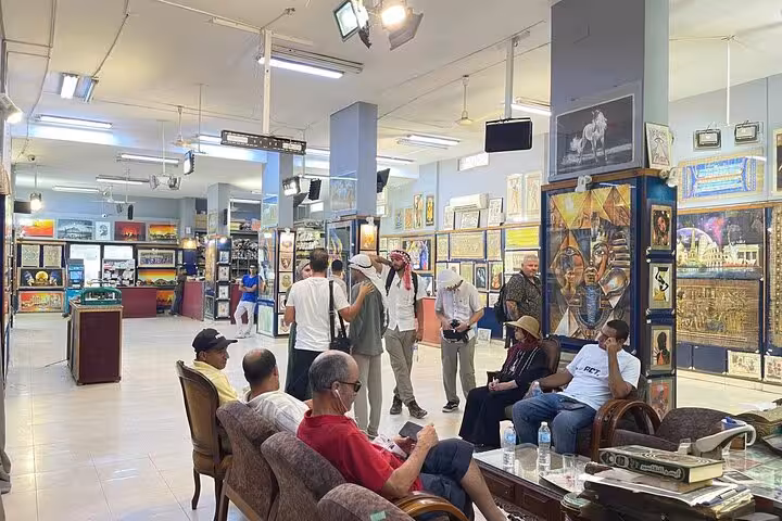Tourists relax in Cairo bazaar gallery with Egyptian art, ideal stop on 4-day Cairo tour with hotel stay