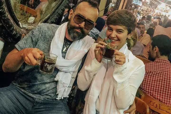 Travelers sip traditional tea in Cairo bazaar café on National Museum to Citadel & Bazaars tour
