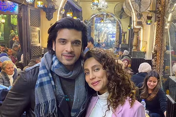 Couple inside El Fishawy Cafe Khan el Khalili Cairo, a stop on Cairo by Night tour with traditional ambiance