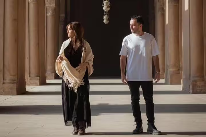 Couple walking through historic columns at Cairo Citadel on a 3-day Cairo highlights guided tour in Egypt