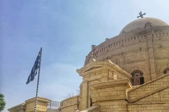 Cairo Citadel dome and flag under blue sky, visited on private Cairo tour from Marsa Alam by flight