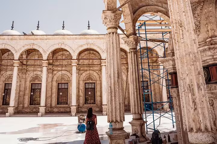 Historic arches and columns inside Cairo Citadel mosque courtyard, key stop on Giza Pyramids and Coptic Cairo tour