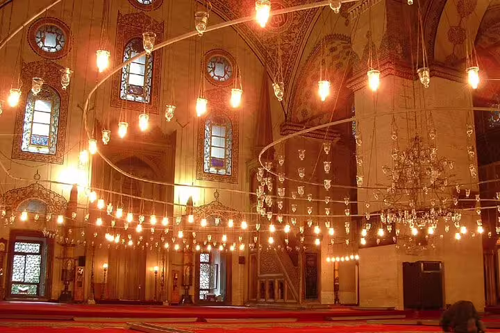 Ornate mosque interior at Cairo Citadel with hanging lamps and arches, highlight of Citadel and museums guided tour