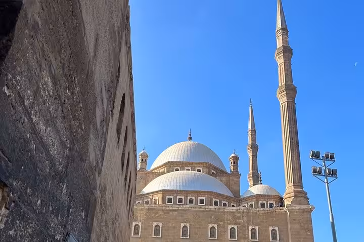 Cairo Citadel mosque domes and minarets under blue sky, stop on private Grand Museum and bazaar tour