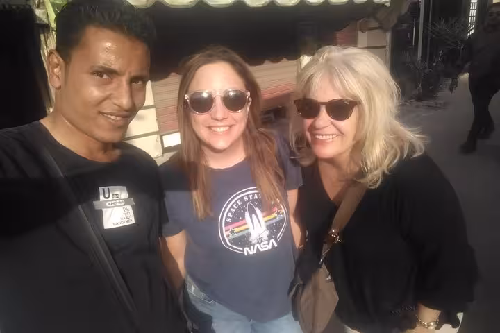 Happy travelers with local guide during Cairo city tour, exploring Egyptian Museum and Old Cairo neighborhoods