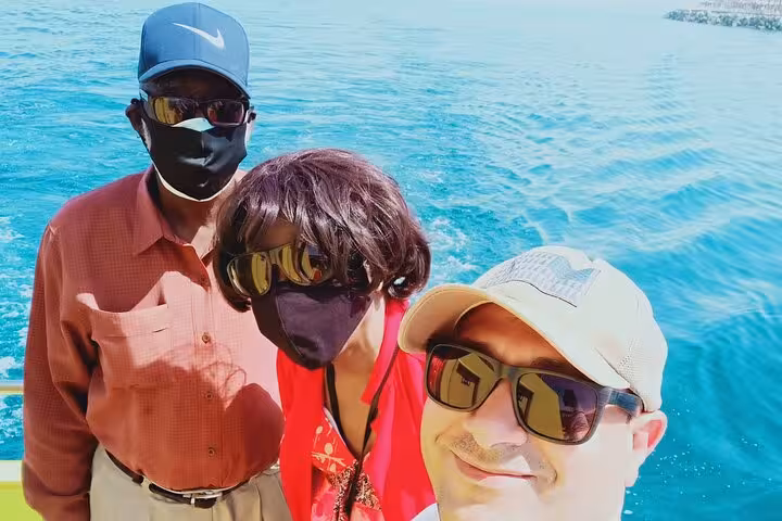 Tourists on a boat in Ain El Sokhna, Red Sea, enjoying a Cairo day trip with sea breeze and views