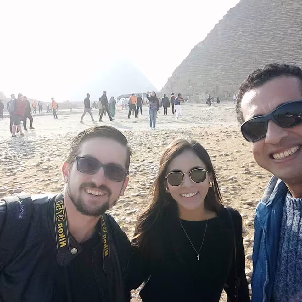 Private Cairo day tour by air from Sharm El Sheikh with travelers at the Great Pyramid of Giza