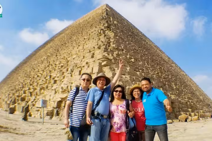 Group photo by the Great Pyramid of Giza on private Cairo day tour from Hurghada, Makadi Bay, Soma Bay, El Gouna