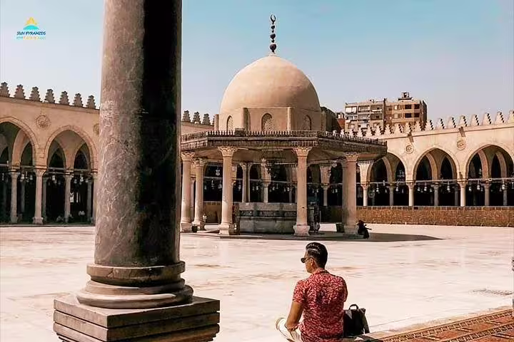 Traveler at Mosque of Muhammad Ali courtyard in Cairo, Egypt on Luxor to Cairo flight day tour