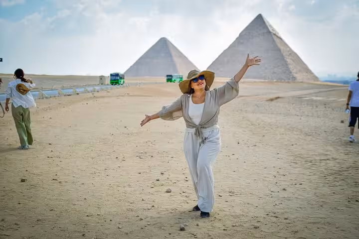 Traveler posing at Giza Pyramids on Cairo day trip visiting Giza, Saqqara and Memphis tour with lunch