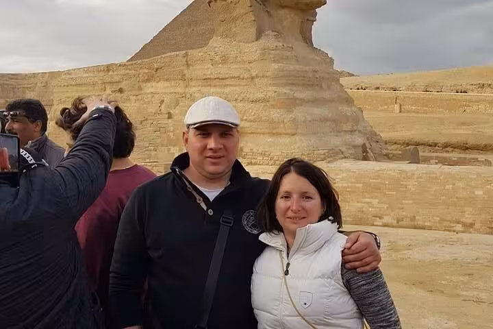 Couple at the Great Sphinx of Giza on a Cairo day tour from Hurghada with domestic flights and guide