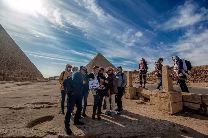 Tour group at the Giza Pyramids on a Cairo full day tour from Alexandria by private car with guide