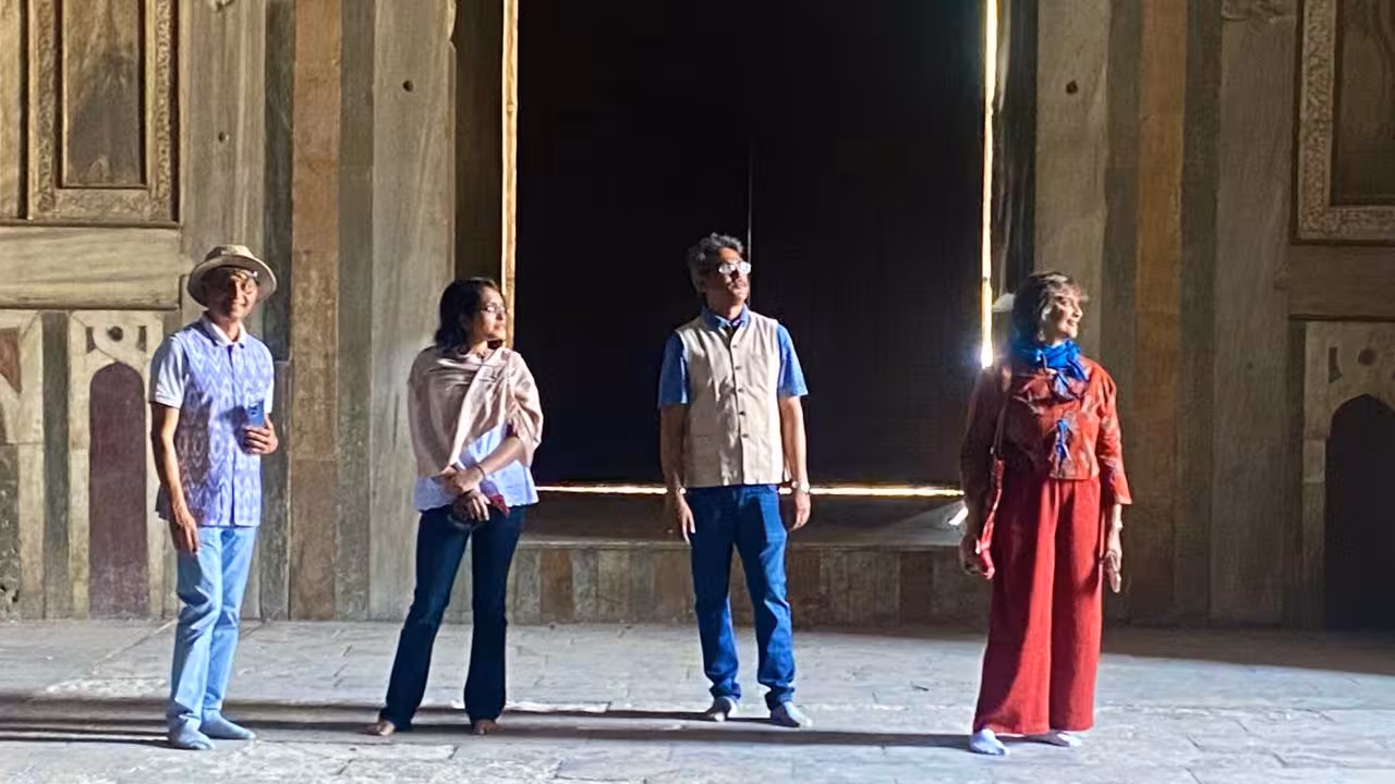 Tourists exploring the historic architecture of Cairo during the Egypt Golden 15 Days tour.