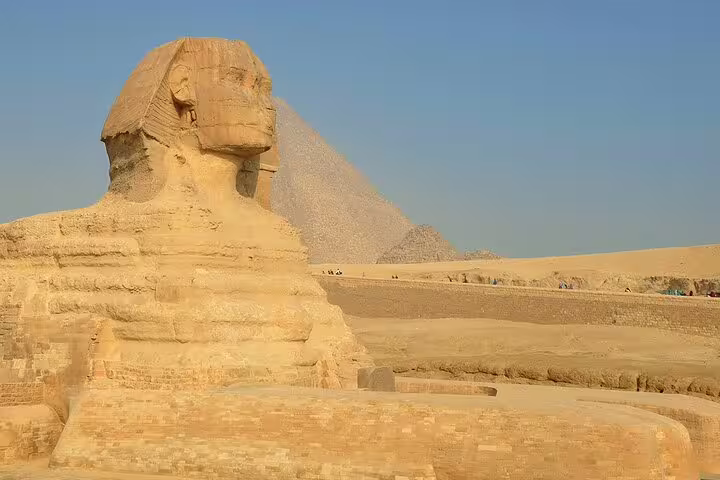 Great Sphinx with Giza Pyramid backdrop on Cairo layover tour to pyramids, Memphis, Sakkara and Dahshur