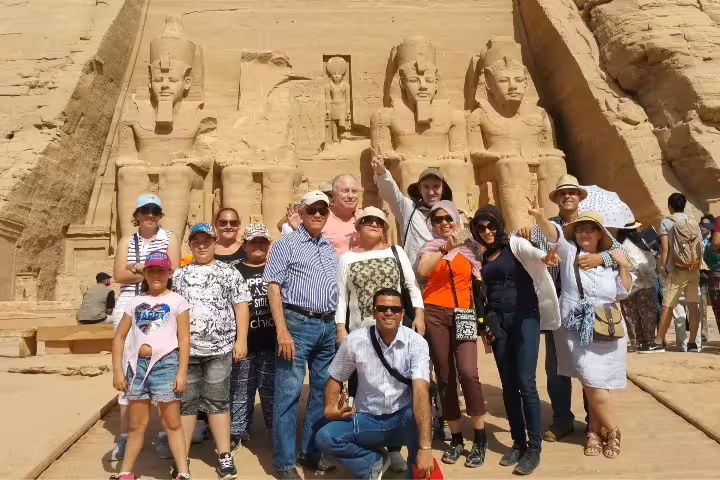 Tour group photo at Abu Simbel Great Temple of Ramses II, part of 7-day Cairo Luxor Aswan Abu Simbel by air