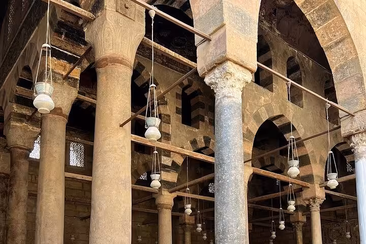 Historic mosque arches and stone columns in Cairo, Egypt, on a 3-day private Giza Cairo Alexandria tour
