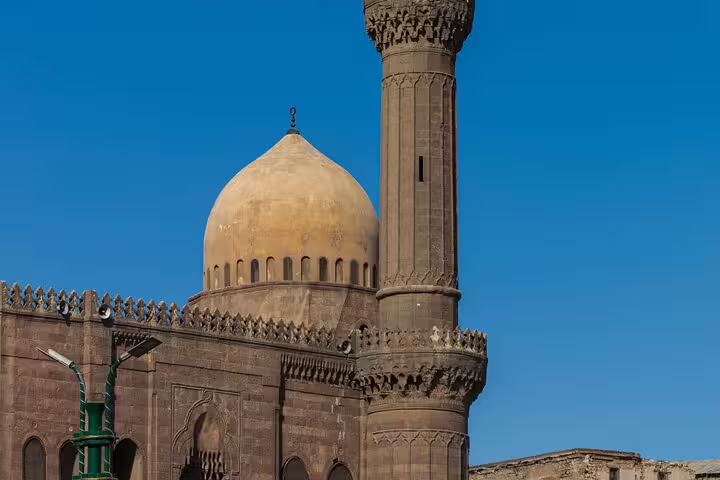 Historic Cairo mosque dome and minaret under blue sky on Citadel and Bazaar and Cairo Mosques Tour