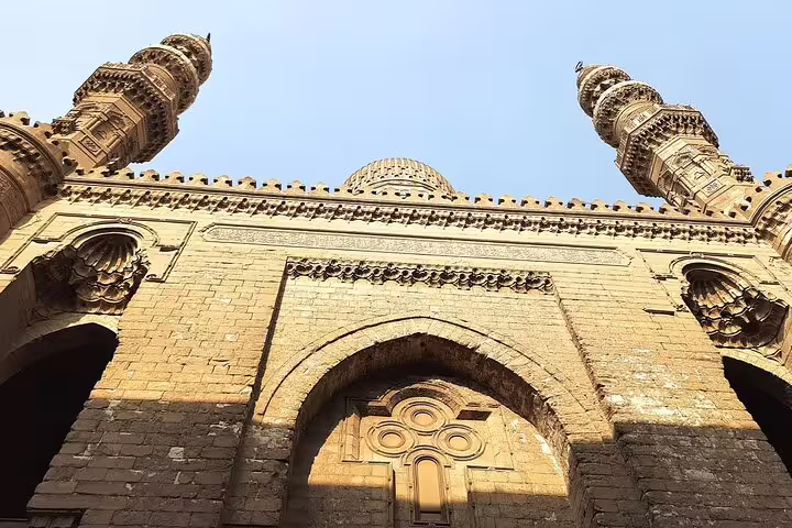 Historic Cairo mosque facade near Khan El Khalili Bazaar, featured on Giza Pyramids and Egyptian Museum day tour