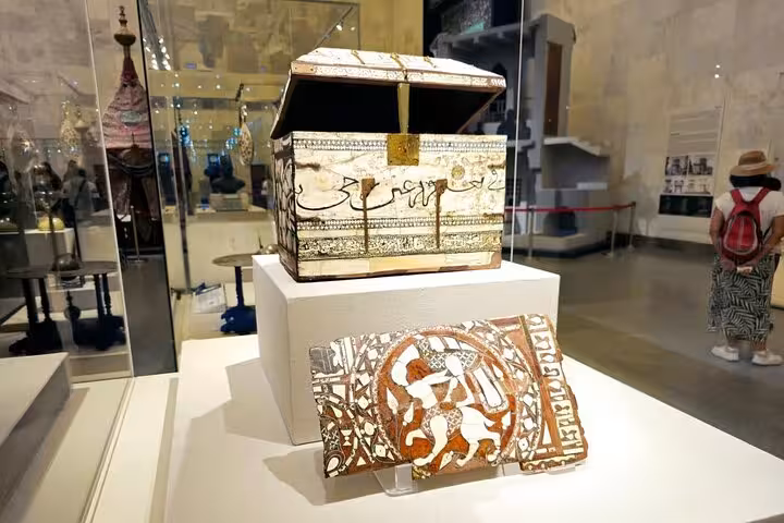 Decorated antique chest and mosaic panel exhibit at Cairo National Museum of Egypt, scan-and-go QR ticket