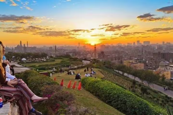Sunset skyline view from Al Azhar Park Cairo on a night tour with dinner and city lights panorama