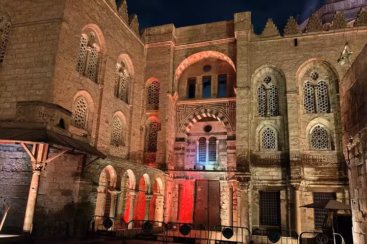 Historic Cairo facade lit at night near Al Muizz Street, a highlight of VIP Khan El Khalili night tour