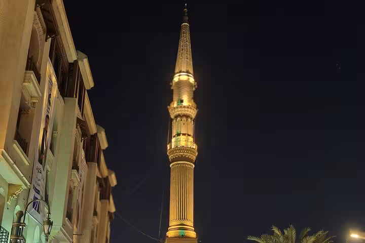 Illuminated mosque minaret on Al Muizz Street at night, highlight of VIP Cairo night tour in Islamic Cairo