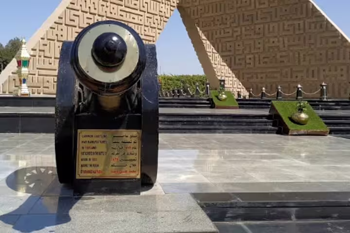 Historic cannon monument in Cairo at night tour stop near Al Moez Street and Islamic Cairo landmarks