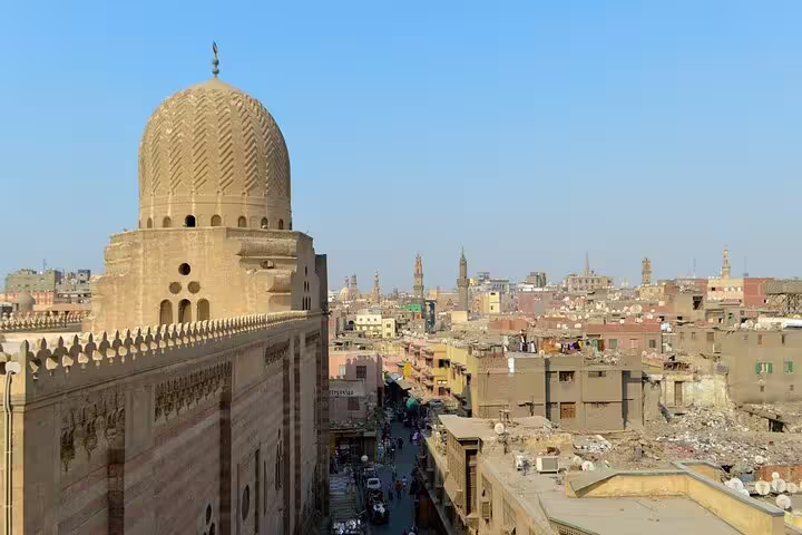 Historic mosque dome overlooking Old Cairo skyline near Al Moez Street on Cairo by Night walking tour