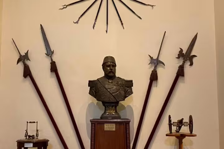 Historic military bust and ceremonial spears display in Old Cairo, a stop on Cairo by Night tour