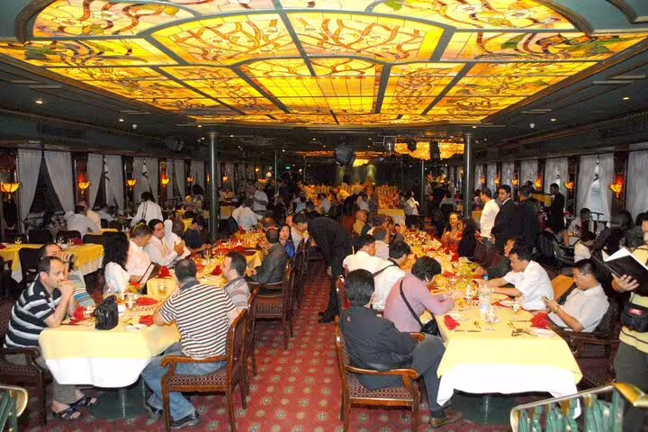 Cairo Nile dinner cruise buffet dining hall with stained-glass ceiling, after Egyptian Museum Citadel Coptic Cairo