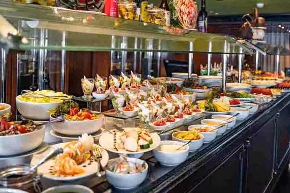 Gourmet buffet spread on Cairo Nile River dinner cruise, featuring salads, appetizers and desserts on board