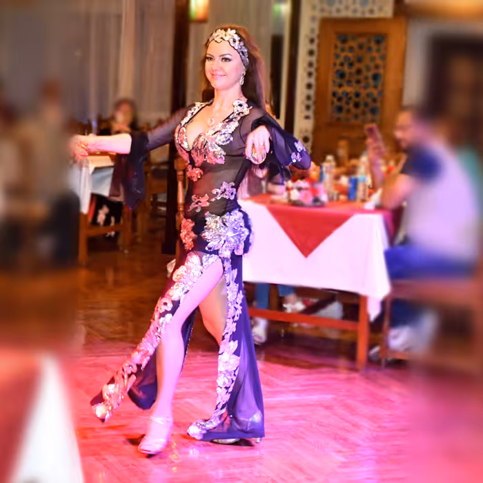 Belly dancer performing during Cairo Nile River dinner cruise, offering Egyptian entertainment with dinner