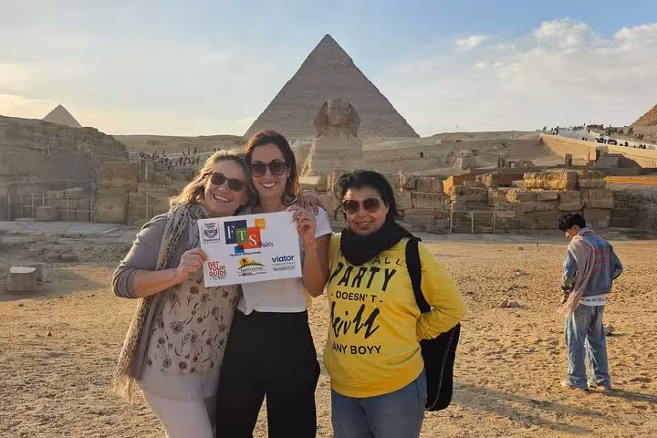 Travelers pose at the Great Sphinx and Giza Pyramids on a Cairo private tour with guide and photo stop