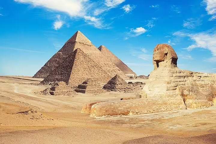 Great Sphinx with the Giza Pyramids under blue sky, Cairo photo session add-on tour landmark view