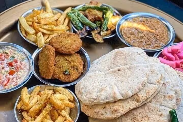 Cairo street food platter with falafel, pita, fries and dips on Historic Islamic Cairo walking tour