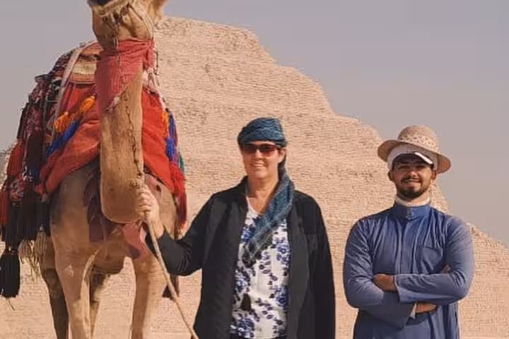 Traveler and guide with camel at Saqqara Step Pyramid, 3 days Cairo all-inclusive pyramids, museums, churches