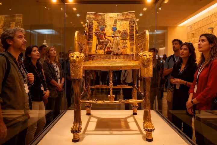 Travelers viewing Tutankhamun’s golden throne at the Egyptian Museum on a Cairo full-day private tour