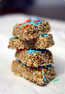 Traditional Calabrian sesame and honey giuggiulena sweets with colorful sprinkles served as a local treat on Scilla food tours