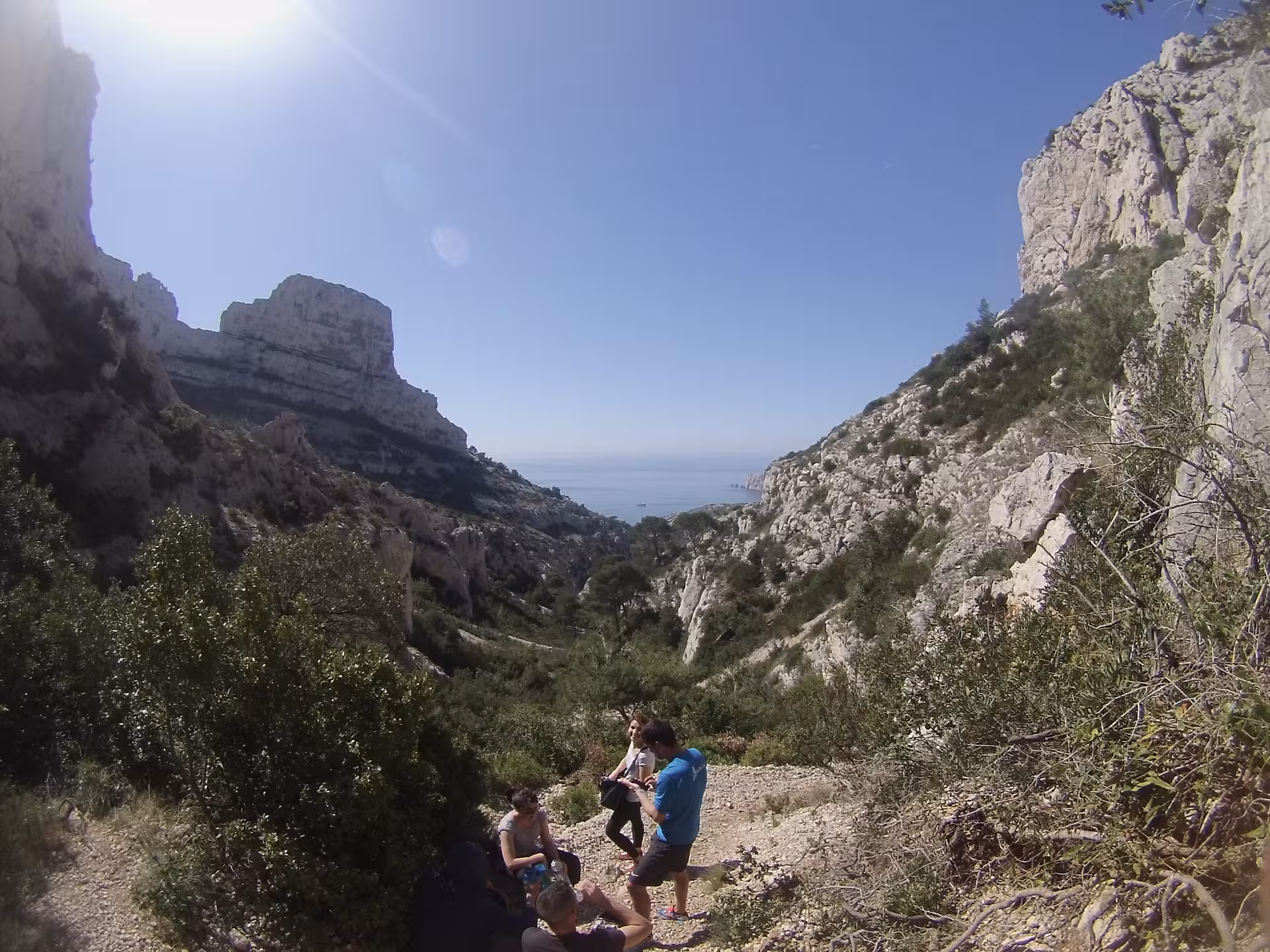 Group hiking in a Calanques valley with Mediterranean sea views near Marseille on a 3-day guided trek
