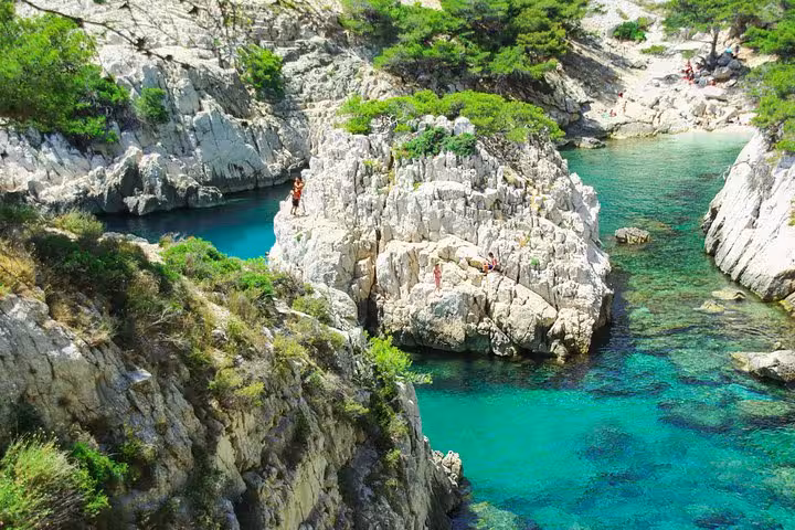 Turquoise lagoon and limestone rocks in Calanques National Park, Marseille hiking tour with scenic coastal coves