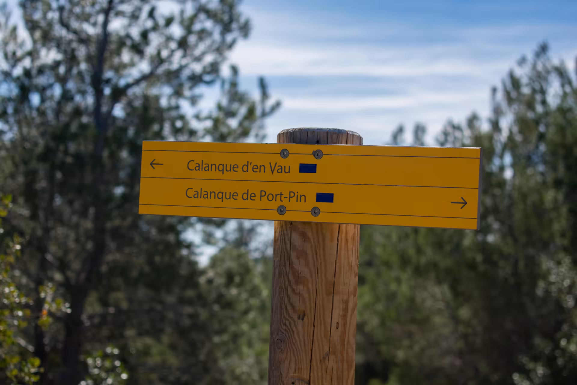 Trail sign to Calanque d’en Vau and Port-Pin on the Luminy hiking route in Calanques National Park Marseille