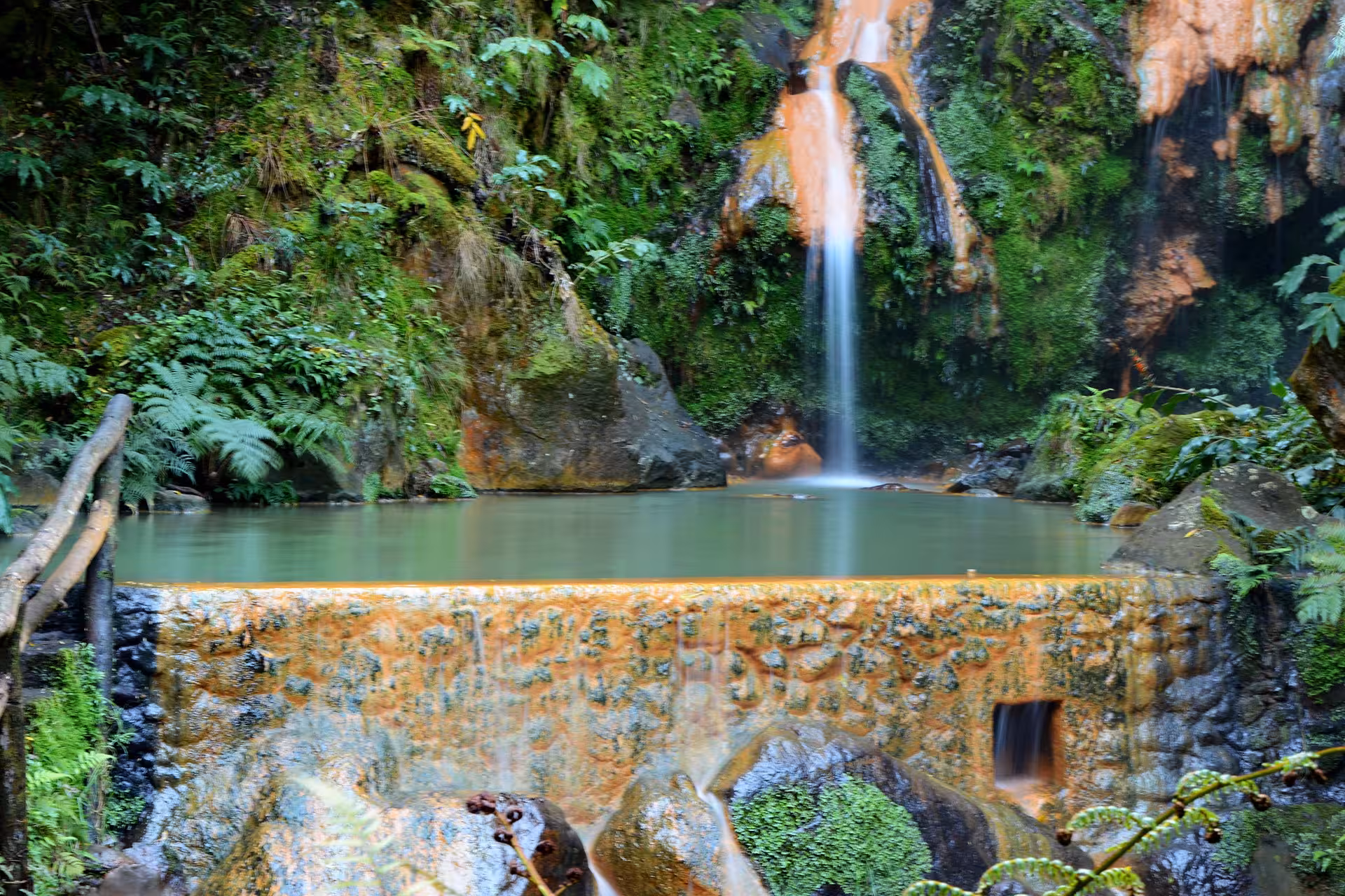 Caldeira Velha hot spring waterfall and thermal pool in lush Azores forest on Window to Hell walking tour
